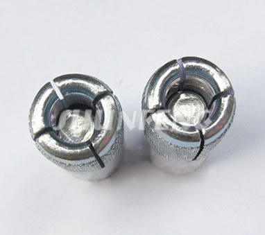 Two drop-in anchors show their internal expander plugs.